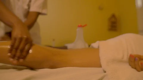 Masseur massaging a leg Stock Footage 117598178