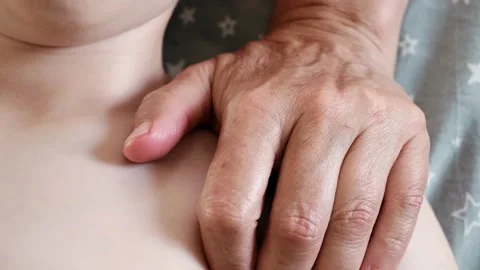 The masseur is massaging the shoulder of the child. A session of therapeutic Stock Footage 314455932
