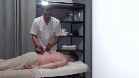 https://images.pond5.com/masseur-uniform-massaging-mans-neck-footage-130225023_iconl.jpeg