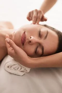 Masseuse doing massage to client Stock Photos