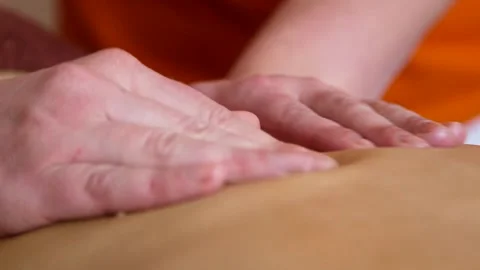 Masseuse Gently Pressing Fingertips of Both Hands Massages Naked Womans Back Stock Footage 293746032