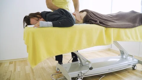 The masseuse hands massage back and spine Stock Footage 127877233