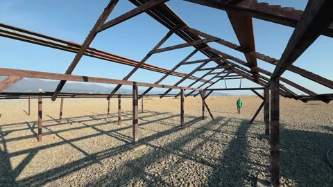 Massive Abandoned Wooden Skeletal Framework On Desolate Pebble Beach With S.. 스톡 동영상 330857506