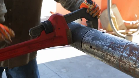 Massive adjustable pipe wrench in metal shop Stock Footage 125833511