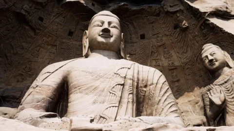 Massive Ancient Buddha Statues Carved Into Sandstone Cliff Face 库存影片 339080030