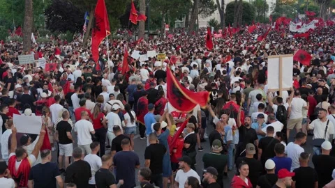 Massive anti corruption rally features crowd with flags in front of Albania Stock Footage 338033194
