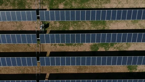 Massive arrays of solar panels gather sunlight and convert it to clean energy Stockbeeldmateriaal 104577253