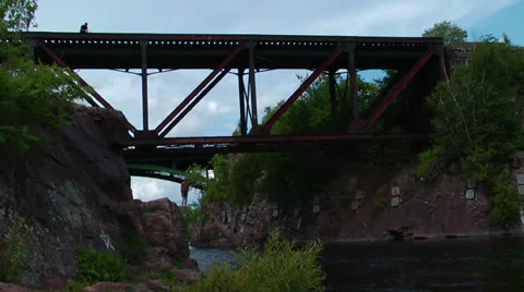 Massive backflip off train bridge into water Stock Footage 27692699