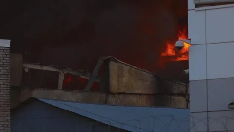 Massive blaze fire, building burning, firefighters team putting out the fire Stock Footage 283132840