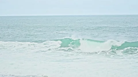 Massive Blue Ocean Wave Rolling Powerfully in Open Tropical Sea Stock Footage 296570738