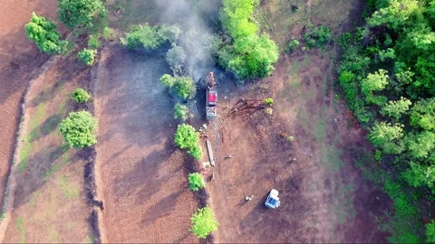 Massive boring device digs deeply on earth surface Stock Footage 302070305