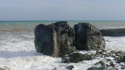 Massive boulders on beach during storm, close-up Stock Footage 80427311