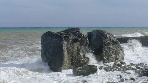 Massive boulders on beach during storm, close-up Stock Footage 80427699