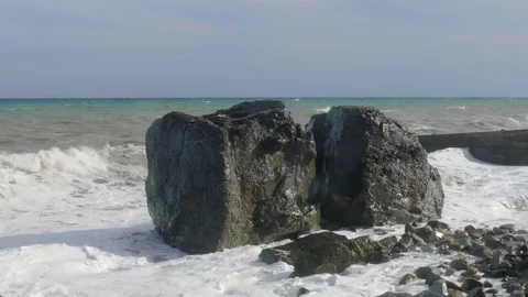 Massive boulders on beach during storm, close-up Stock Footage 80427841