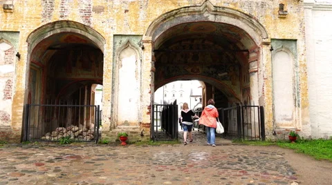 Massive brick arches engraved and icons to pass a large Assumption Monastery Stock Footage 68059636