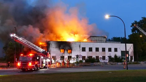 Massive building in flames Stock Footage 116120481