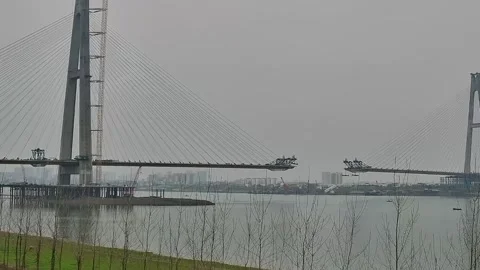 Massive Cable-Stayed Bridge Construction Over River in China 스톡 동영상 334765562