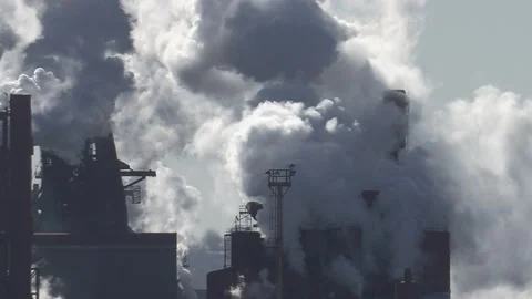 Massive carbon and emissions spewing pollution from industrial smokestack Video stock 169407739