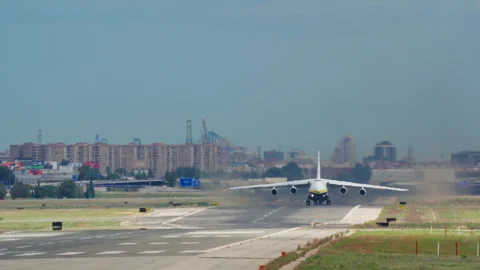 Massive cargo aircraft with four engines taking off from runway Video stock 336852329