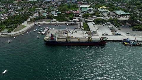 Massive cargo ship at coastal logistics hub. Stock Footage 336917193