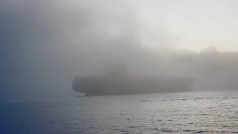 Massive cargo ship with containers enters San Francisco Bay in early morning fog Stock Footage 242830743