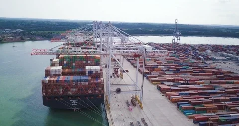 Massive cargo ship loading up at port Stock Footage 89771396