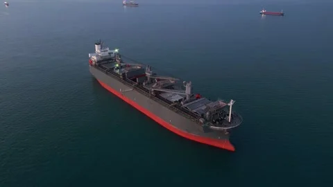 A massive cargo ship wood chips carrier in the sea, aerial view Stock Footage 258573611