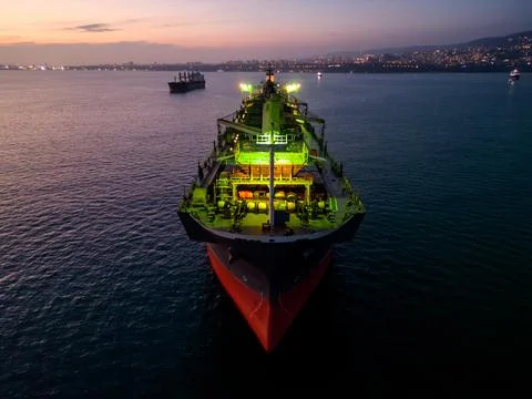 A massive cargo ship wood chips carrier in the sea, aerial view Stock Photos