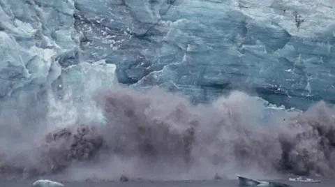 Massive chunks of the glacier's face turn loose and make dramatic splash. Stock Footage 67616121