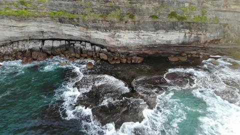 Massive cliff next to the ocean Stock Footage 136546386