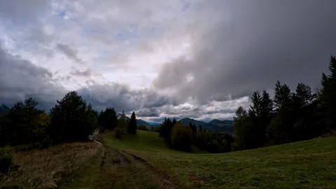 Massive cloud cover in Carpathian mountain landscape at dusk, timelapse fast Video stock 306061898