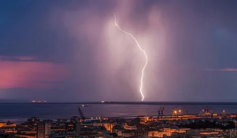 Massive cloud to ground lightning bolts hitting Stock Photos