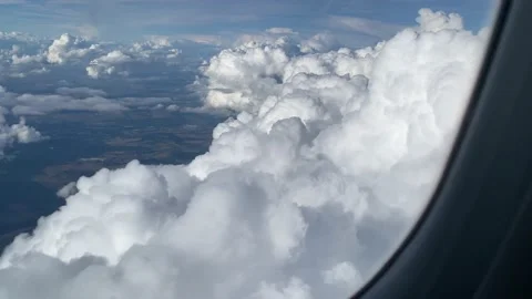 Massive clouds in airplane window Stock Footage 161095268