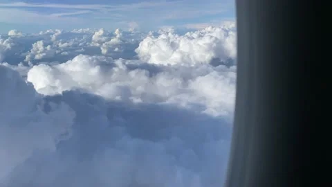 Massive clouds in airplane window Stock Footage 161095326
