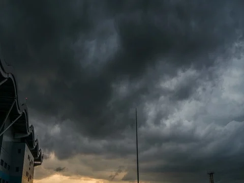 Massive clouds near airport during thunder and sunset Stock Footage
