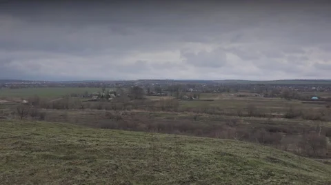 Massive Clouds Over a Willage. 4K UltraHD, UHD Vídeos de archivo 49136743