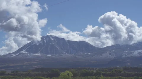 Massive clouds rolling over mountain Stock Footage 68536586