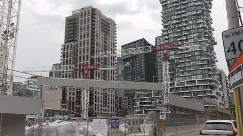 Massive Construction cranes building new condos in downtown Toronto Stock Footage 155917293