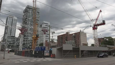 Massive Construction cranes building new condos in downtown Toronto Stock Footage 155920734