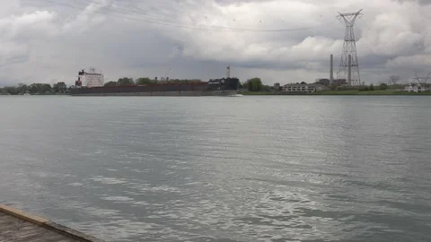 Massive container and cargo ship heading up river to oil refinery in Sarnia Stockbeeldmateriaal 153830689