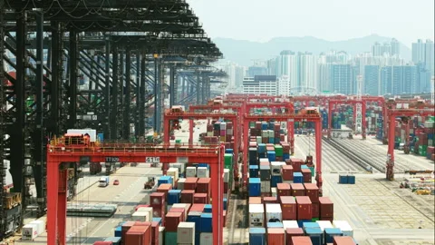 Massive Container Cranes Transporting Cargo Containers at the Hong Kong Maritime Stock Footage 310604238