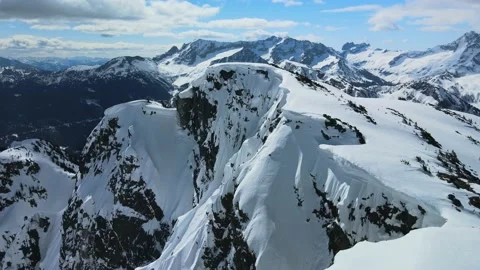 Massive Cornices on Snow Covered Mountain, Aerial Drone Shot Stock Footage 169554085