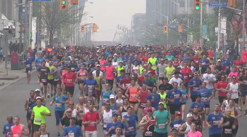 Massive crowd of marathon runners in the streets of the city of Toronto Stock Footage 49941773