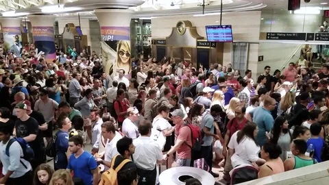 Massive crowd in Penn station NJTransit summer rush Stock Footage 77683803