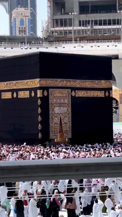 Massive Crowd of Pilgrims Performing Tawaf Around the Holy Kaaba at Masjid al-Ha Stock Footage 323159173