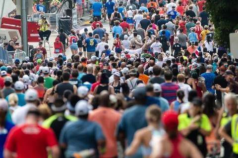 Massive crowd of runners nears finish of Peachtree Road Race Stock Photos