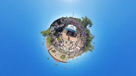 Massive Crowd in a "Tiny Planet" Fisheye Effect Video stock 320379280
