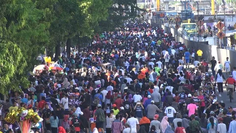 Massive crowds walk on roads in downtown Jakarta during car free event Stock Footage 78571663