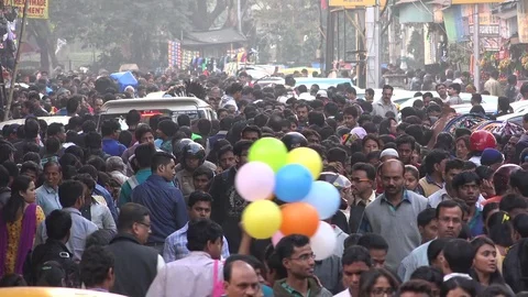Massive crowds walk through a busy shopping street in Kolkata, India Stock Footage 71505317