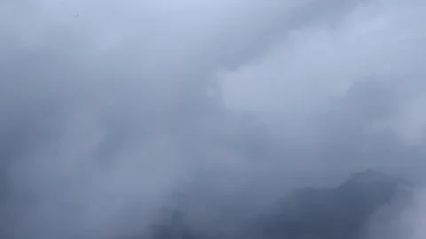 Massive Dark Rain Clouds Move Into The Shot From The Left Above The Hill Stock Footage 162659886
